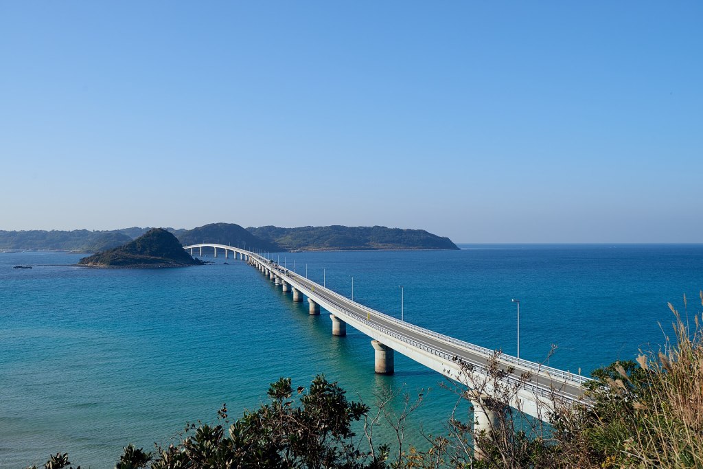 Tsunoshima Bridge curving across the Sea of Japan seen from the island side