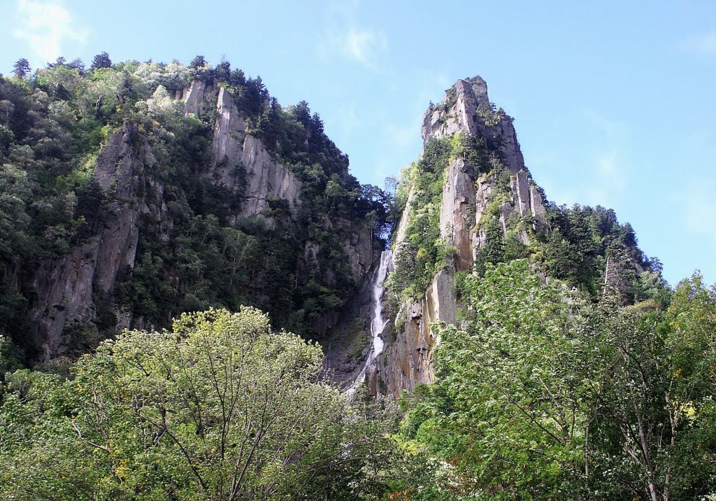 Ginga Falls dropping in thin threads down a cliff in Sounkyo Gorge, Hokkaido