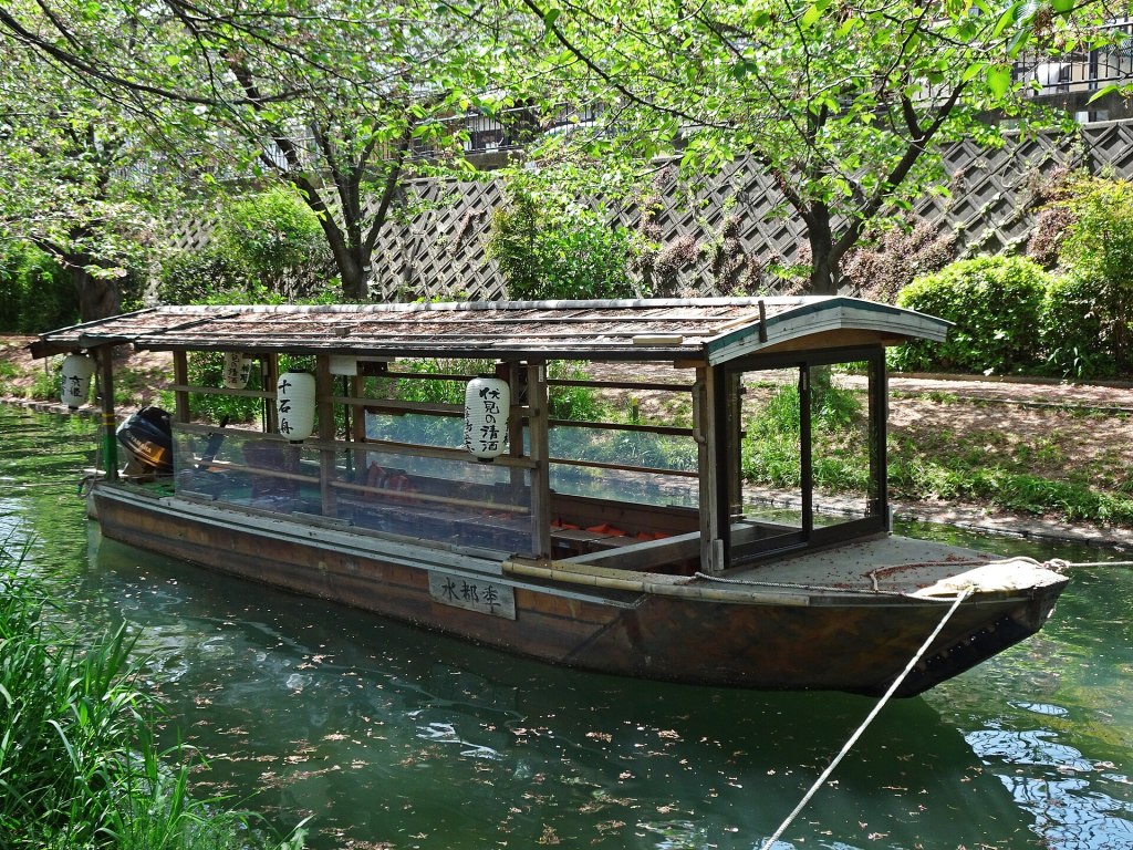 Traditional boat on the Fushimi Horikawa canal in Kyoto, Japan
