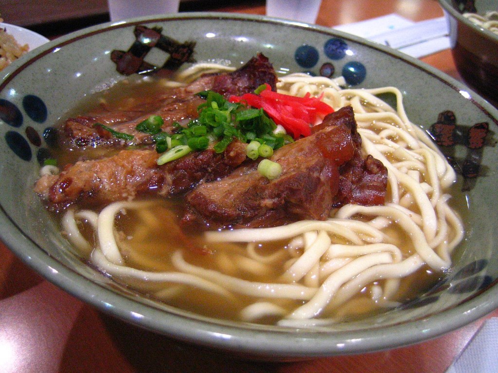 A bowl of soki soba, Okinawan noodle soup topped with braised pork ribs