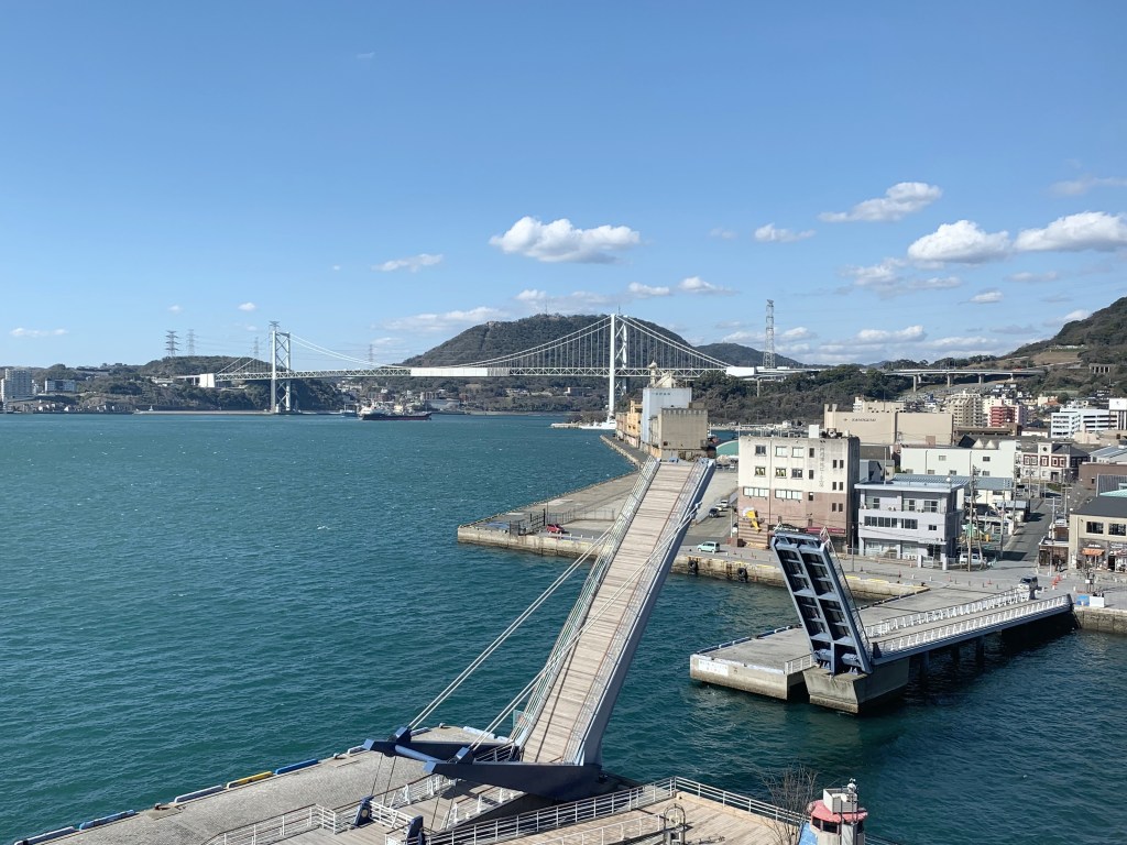 Blue Wing Moji bascule bridge with the Kanmon Bridge behind it
