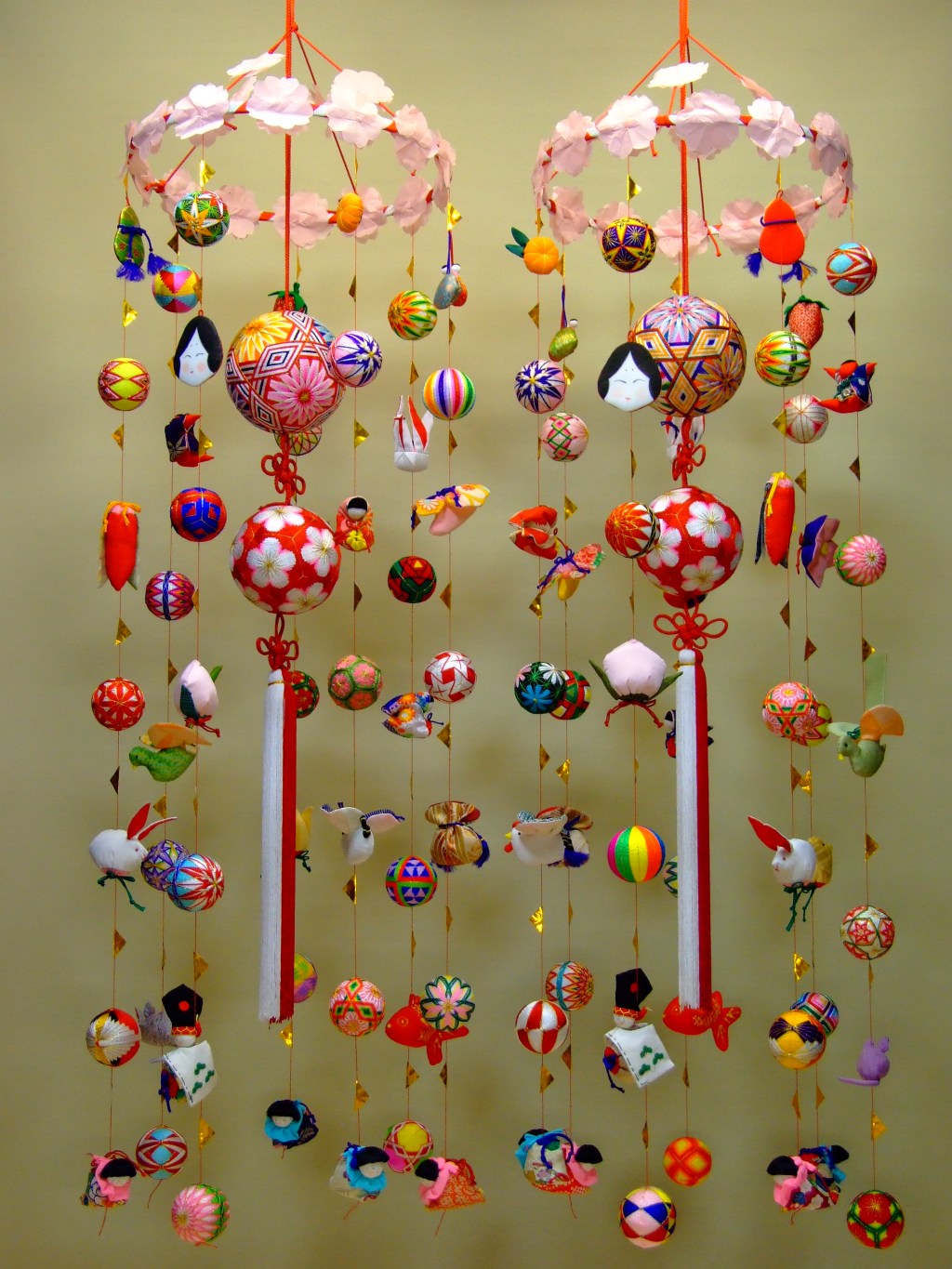 A colourful hanging sagemon ornament made of fabric dolls and charms
