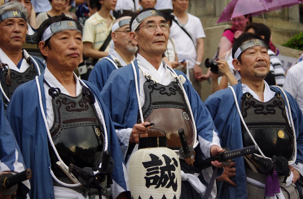 The Gion Matsuri float procession moving along a Kyoto street