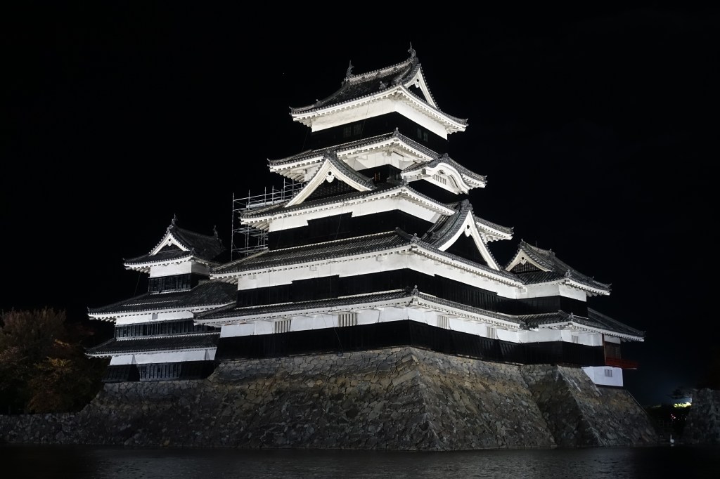 Matsumoto Castle lit at night in Nagano, Japan