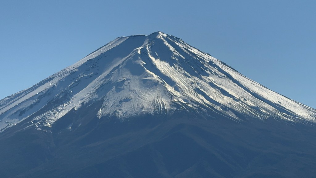 Close view of the snow-covered summit of Mount Fuji in winter