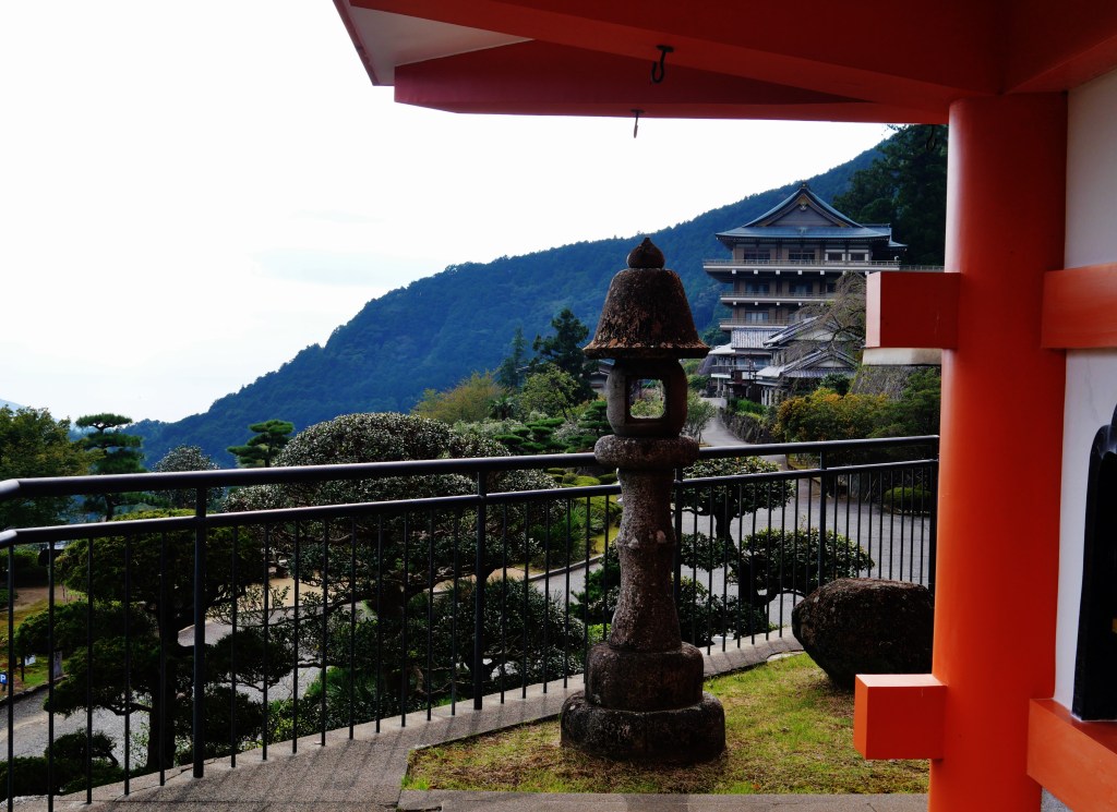 Stone steps leading up to the wooden main hall of Seiganto-ji