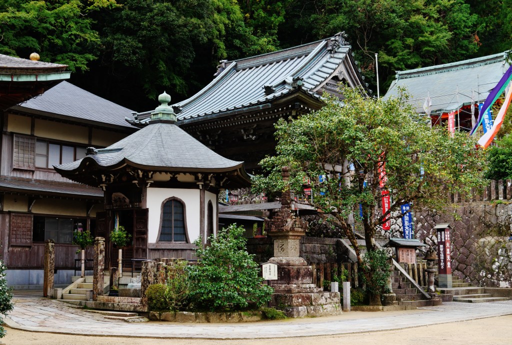 Weathered wooden main hall of Seiganto-ji under a cedar-bark roof