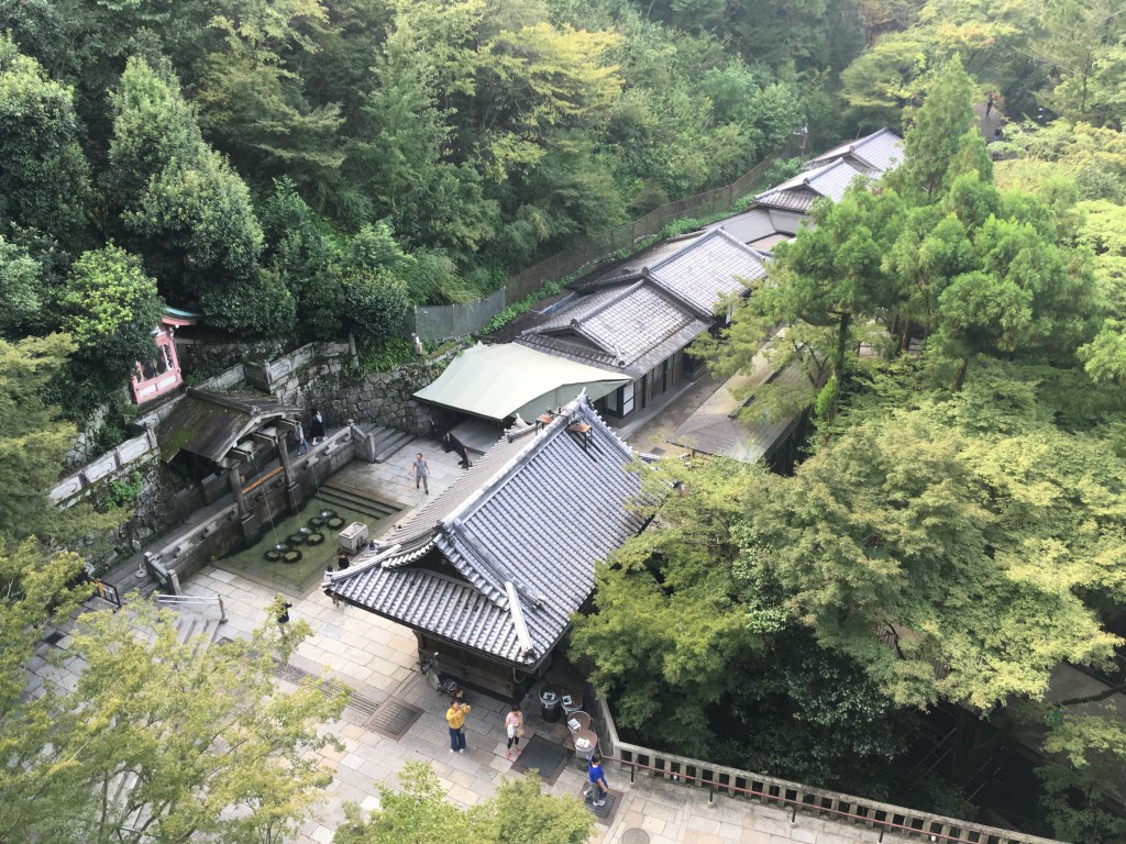 The Otowa Waterfall at Kiyomizu-dera with visitors catching water in ladles