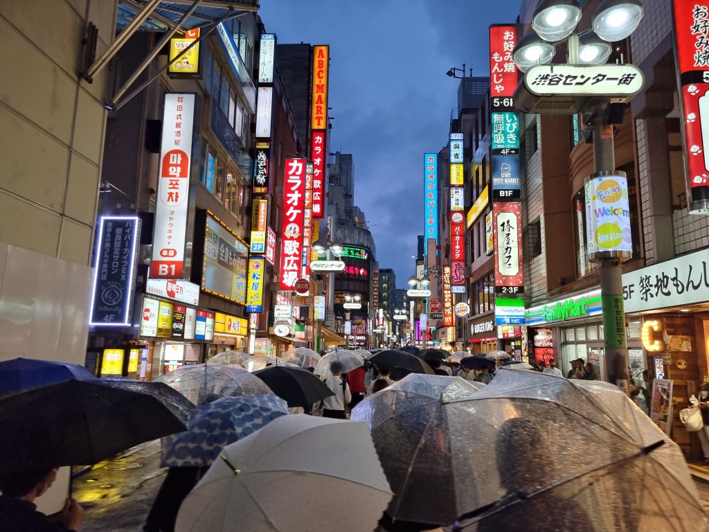 The pedestrian street of Shibuya Center-gai on a rainy afternoon