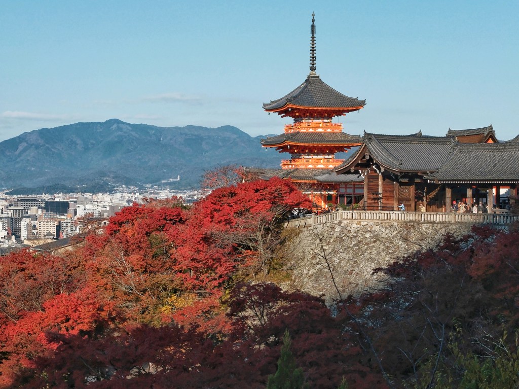 The three-storey pagoda of Kiyomizu-dera surrounded by autumn foliage